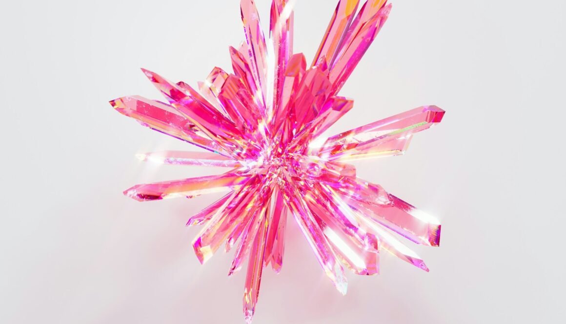 a close up of a pink object on a white surface